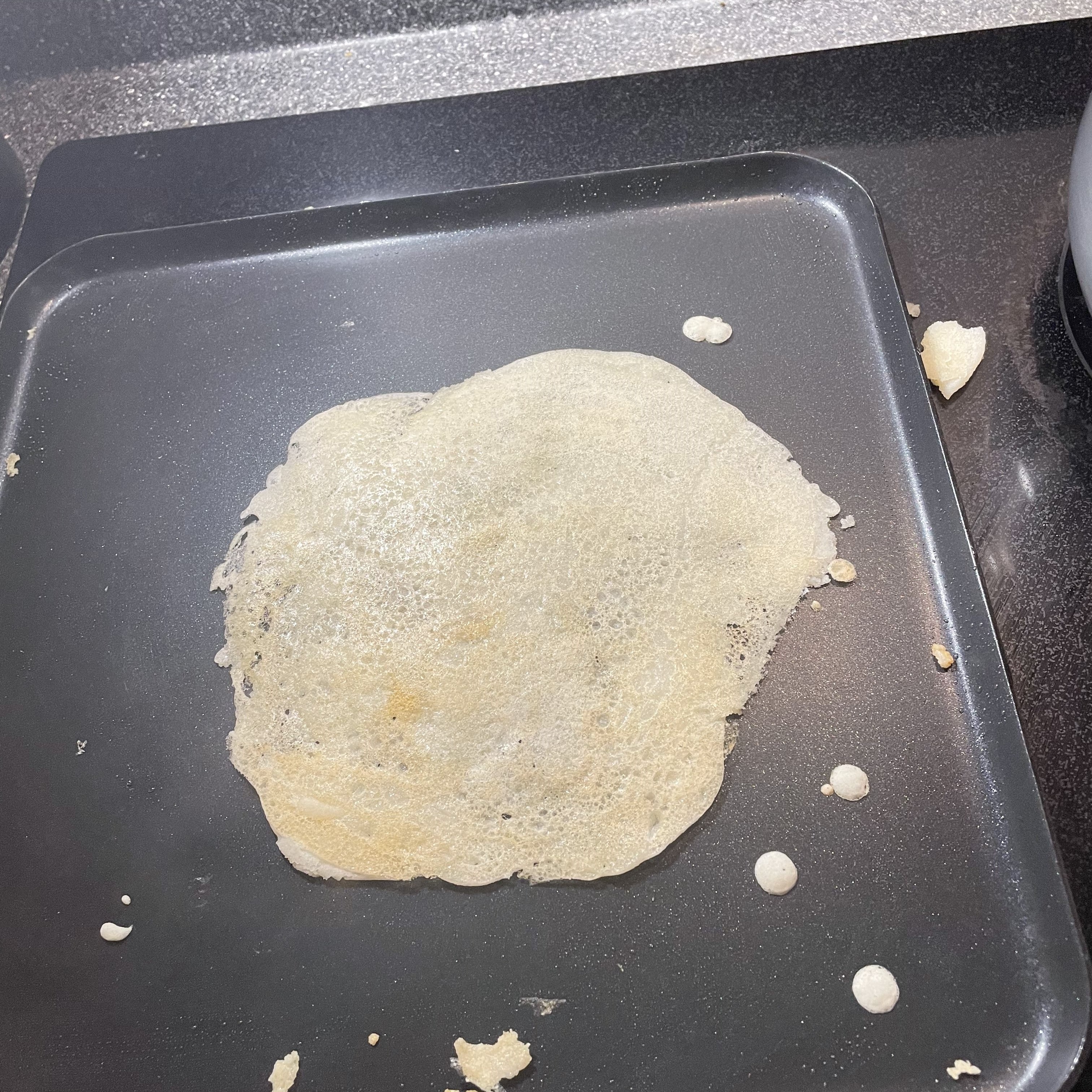 pan with a dosa on it